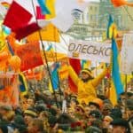 Colorful Ukrainian flags at a political rally emphasizing national pride and unity.