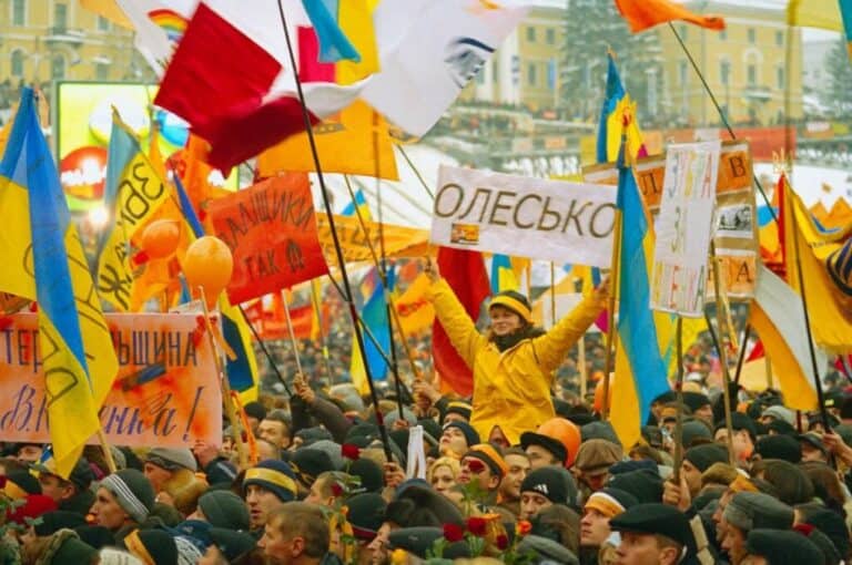 Colorful Ukrainian flags at a political rally emphasizing national pride and unity.